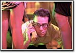 Scott (Matt Dawson) signals for help at a "Pink House" party.